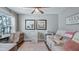 Cozy office space with lake view, love seat, and a charming desk area at 12117 Cypress Ln, Clermont, FL 34711