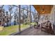 Relaxing sunroom with floor-to-ceiling windows and waterfront views at 12117 Cypress Ln, Clermont, FL 34711