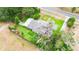 Aerial view of a home on a large lot with mature trees at 132 E Belt Ave, Bushnell, FL 33513