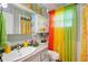 Bathroom featuring colorful decor, including a sea horse, bright curtains and a vanity at 132 E Belt Ave, Bushnell, FL 33513