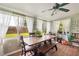 Cozy dining room with natural light and a large wooden table at 132 E Belt Ave, Bushnell, FL 33513