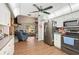 Open-concept kitchen flowing into the living area at 132 E Belt Ave, Bushnell, FL 33513