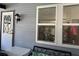 Welcoming side entry door to the home with a view to the window and sitting area at 1336 E Schwartz Blvd, The Villages, FL 32159