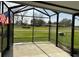 Screened porch featuring a view of the green yard at 1336 E Schwartz Blvd, The Villages, FL 32159