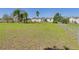 Large lot featuring a lush green lawn and mature trees, providing ample outdoor space and privacy at 13877 County Road 109F, Lady Lake, FL 32159