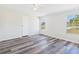 Bedroom featuring modern flooring and natural light at 13877 County Road 109F, Lady Lake, FL 32159