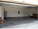 Spacious two car garage with painted concrete floors at 1408 Diamond Loop Dr, Kissimmee, FL 34744