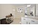 Kitchen area with tile floors, bar cart and natural light at 151 Shiloh Ave, Lady Lake, FL 32159