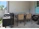 Patio with table, chairs, and grill at 151 Shiloh Ave, Lady Lake, FL 32159