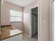 Granite vanity in bathroom with shower and natural lighting from the window at 15318 Margaux Dr, Clermont, FL 34714