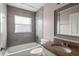 Tiled bathroom with granite vanity, bathtub, and shower combination at 15318 Margaux Dr, Clermont, FL 34714