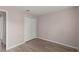 Comfortable bedroom featuring a double door closet and plank flooring at 15318 Margaux Dr, Clermont, FL 34714