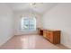 Bright bedroom features a wooden desk, large window, and ample natural light at 16839 Rockwell Heights Ln, Clermont, FL 34711