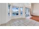 Sunlit breakfast nook with tile flooring and views of the screened in pool area at 16839 Rockwell Heights Ln, Clermont, FL 34711