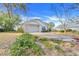 A home with manicured lawn and mature landscaping at 16839 Rockwell Heights Ln, Clermont, FL 34711