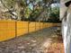 Spacious backyard featuring a new wood fence and lush landscaping at 1700 Hollywood Ave, Eustis, FL 32726