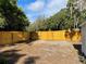 Expansive backyard enclosed by a new wooden fence, ensuring privacy at 1700 Hollywood Ave, Eustis, FL 32726