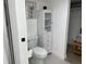 Bathroom displaying a toilet, cabinet and open closet area at 1700 Hollywood Ave, Eustis, FL 32726