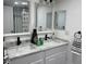 Bright bathroom featuring a double sink vanity, white cabinets, and modern fixtures at 1700 Hollywood Ave, Eustis, FL 32726