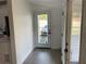 Bright entryway with modern flooring, a glass-paneled door, and neutral paint at 1700 Hollywood Ave, Eustis, FL 32726