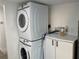 Modern stacked washer and dryer in a clean, efficient laundry area at 1700 Hollywood Ave, Eustis, FL 32726