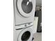 Close-up of a modern stacked washer and dryer in a laundry area at 1700 Hollywood Ave, Eustis, FL 32726