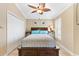 Inviting bedroom featuring neutral tones, tile flooring, and stylish furnishings at 17126 Se 78Th Larchmont Ct, The Villages, FL 32162