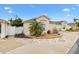 Charming home exterior with well-manicured landscaping, a circular driveway, and a welcoming entrance at 17126 Se 78Th Larchmont Ct, The Villages, FL 32162