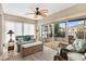 Relaxing sunroom featuring neutral tones, tile flooring, and comfortable seating at 17126 Se 78Th Larchmont Ct, The Villages, FL 32162