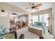 Serene sunroom featuring neutral tones, tile flooring, and comfortable seating at 17126 Se 78Th Larchmont Ct, The Villages, FL 32162