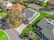 Aerial view of a home with mature trees, and a well-manicured lawn at 17635 Se 82Nd Annadale Ter, The Villages, FL 32162