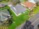 Aerial view of a home with a well-maintained lawn, surrounded by lush landscaping at 17635 Se 82Nd Annadale Ter, The Villages, FL 32162