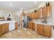 Spacious kitchen featuring ample cabinet space, stainless steel appliances, and neutral countertops at 17635 Se 82Nd Annadale Ter, The Villages, FL 32162