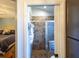 Tiled shower with glass door is seen from the Primary bedroom at 1828 Augustine Dr, The Villages, FL 32159