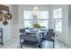 Breakfast nook with an elegant chandelier, and a large window offering lots of natural light at 1828 Augustine Dr, The Villages, FL 32159