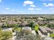 A high-angle shot of a beautiful community with lush landscaping surrounding upscale residences at 2031 Capri Ln, Mount Dora, FL 32757