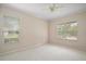 Neutral bedroom with large windows at 2031 Capri Ln, Mount Dora, FL 32757