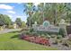 Loch Leven Mount Dora community entrance sign with landscaped flowers and plants on a sunny day at 2031 Capri Ln, Mount Dora, FL 32757