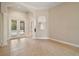 Bright living room with tile flooring, decorative columns, and French doors opening to the pool area at 2031 Capri Ln, Mount Dora, FL 32757