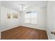 Cozy bedroom featuring a window with blinds and laminate floors at 2039 Palo Alto Ave, The Villages, FL 32159