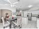 Spacious kitchen featuring stainless steel appliances, a center island, and an adjacent dining area at 2039 Palo Alto Ave, The Villages, FL 32159