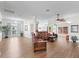 Bright, open living area with wood floors, ceiling fan, and neutral walls at 2039 Palo Alto Ave, The Villages, FL 32159