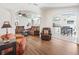 Open living room featuring arched doorways to the kitchen and dining room at 2039 Palo Alto Ave, The Villages, FL 32159