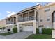 View of the home's garages and screened in balconies at 220 Nautica Mile Dr, Clermont, FL 34711