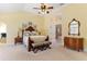 Vaulted ceilings highlight the suite, featuring an en suite bath, and offering plenty of space for relaxation at 220 Nautica Mile Dr, Clermont, FL 34711