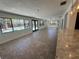 Inviting living room with tiled floors, pool view, and seamless flow into the modern kitchen at 2309 Fairview Ct, Eustis, FL 32726