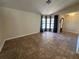 Inviting living area with tile flooring and expansive window offering plenty of natural light at 2309 Fairview Ct, Eustis, FL 32726