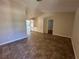 Open-concept living space with tile flooring, providing a seamless transition to the kitchen and other rooms at 2309 Fairview Ct, Eustis, FL 32726