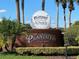 Plantation Golf and Country Club entrance with lush landscaping, brick sign, and golf ball logo at 25517 Laurel Valley Rd, Leesburg, FL 34748