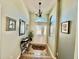 Bright foyer with decorative tile flooring, arched transom window, and an elegant chandelier at 25517 Laurel Valley Rd, Leesburg, FL 34748